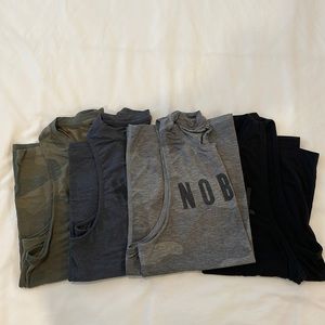 Lot of 4 NOBULL high-neck tanks. All size medium.